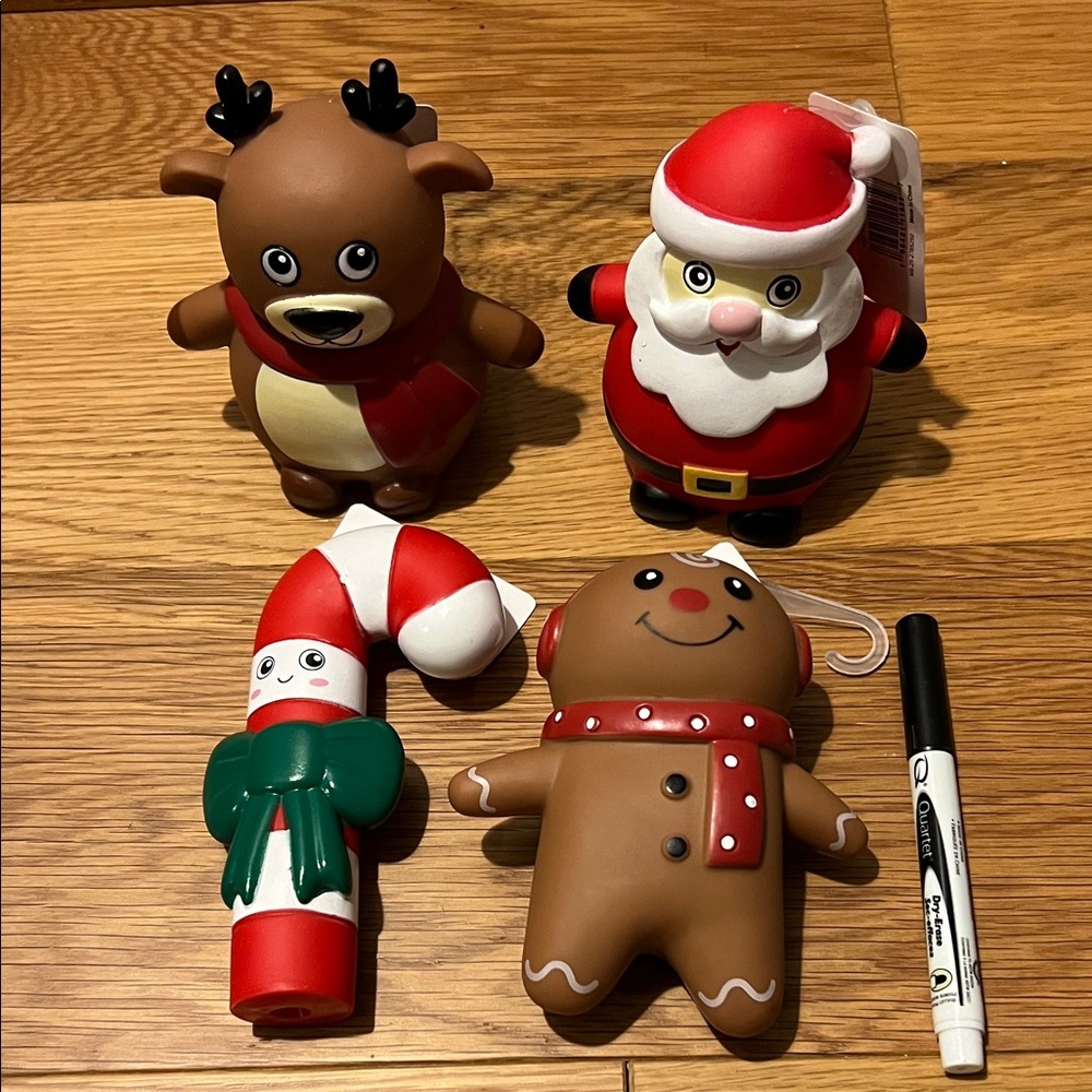 4 Christmas themed dog squeaky toys. New with tags.